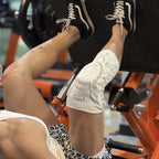 The model is working out wearing the Kuangmi® Smart Knob Knee Brace